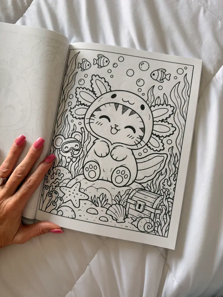 A photo of the open book showing Sassy in an axolotl costume and Squeak with a snorkel.